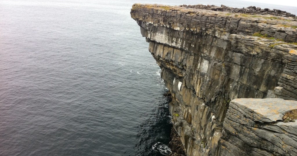 Cliff edge standing over water